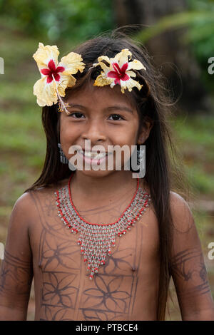 Central America, Panama, Gatun Lake. Embera Indian village. Young Embera girl with flowers in her hair. Stock Photo