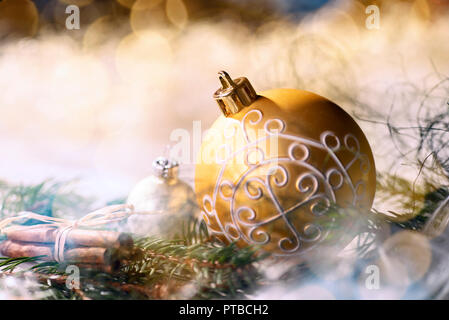 Golden bauble and christmas decoration with fir branches Stock Photo