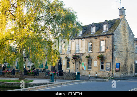 Old manse hotel  in the early morning in autumn. Bourton on the Water, Cotswolds, Gloucestershire, England Stock Photo