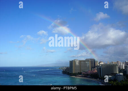 Rainbow over Waikiki Beach Stock Photo