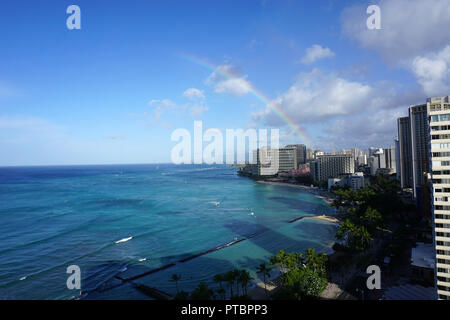 Rainbow over Waikiki Beach Stock Photo