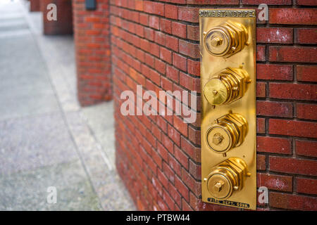 Fire hydrant in a building wall, San Francisco, California, USA Stock Photo