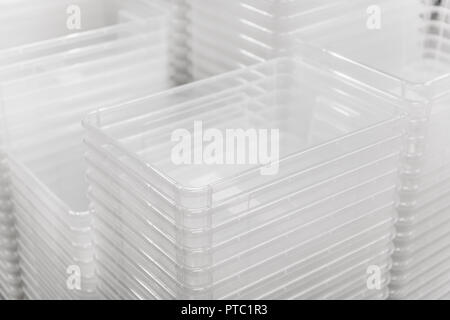 Folded transparent plastic containers boxes at store Stock Photo