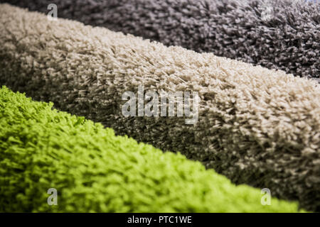set of multi-colored rugs for home at store Stock Photo