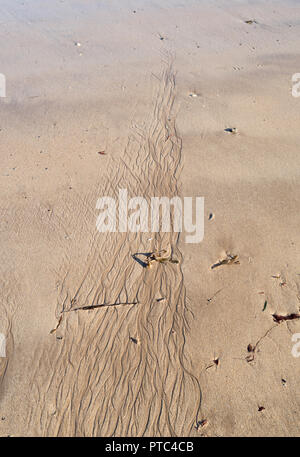 Patterns in the sand on the beach at Low Newton-By-The-Sea, Northumberland, England, UK Stock Photo