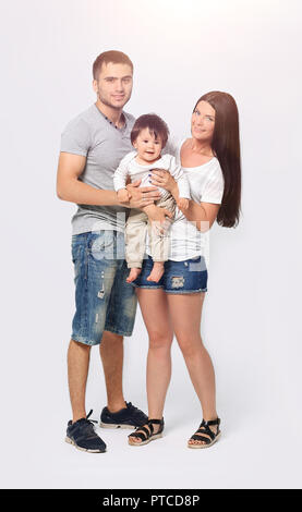 happy three members family on a white background Stock Photo