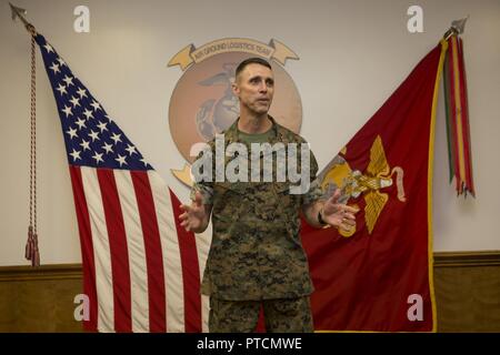 U.S. Marines, family and friends gather for Maj. Gen. Robert F. Castellvi's promotion ceremony on Camp Lejeune, N.C., 11 July, 2017. Castellvi was promoted from Brigadier General to Major General by Maj. Gen. Walter L. Miller. Stock Photo