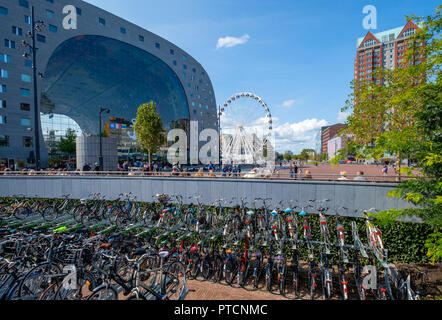 View on the market hall and ferris wheel in Rotterdam and a bicycle parking in the front. Stock Photo