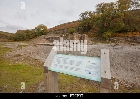 Information board for remains of the once thriving lead mining industry, Gunnerside Gill, Swaledale, Yorkshire Dales, UK. Sir Francis Dressing Floor. Stock Photo