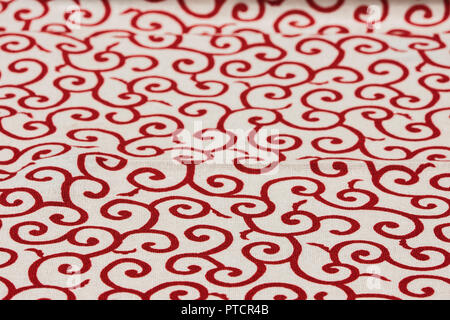 Highly detailed all over background texture of traditional japanese red and white leaves shaped pattern design textile in synthetic fabric.