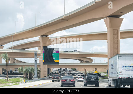 Miami, USA - May 2, 2018: Road street highway green signs under construction on Palmetto Expressway in Florida with ramps, interchange Stock Photo