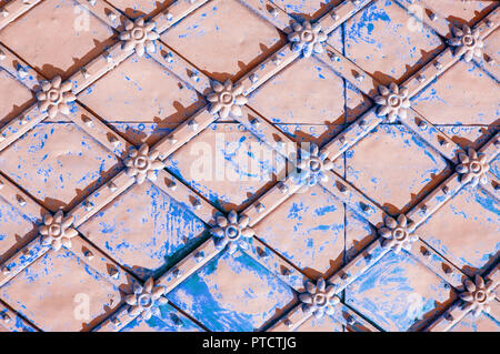 Metal architecture background. Vintage metal brown surface with rusty architectural details in form of flowers Stock Photo