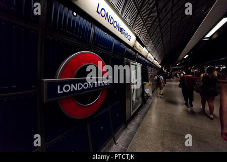 London, UK - June 26, 2018: Underground tube metro with people commuters walking on London Bridge subway platform station Stock Photo