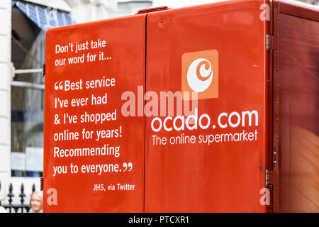 London, UK - September 12, 2018: Ocado online store grocery shopping delivery supermarket sign on truck with red orange color Stock Photo