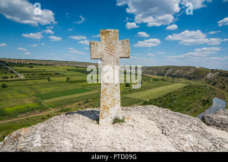 Old christian cross above the historical temple complex of old Orhei or Orheiul Vechi, Moldova Stock Photo