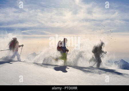 Three snowshoe walkers walking in the snow, snowshoe tour to the Fellhorn, Reit im Winkl, Bavaria, Upper Bavaria, Germany Stock Photo
