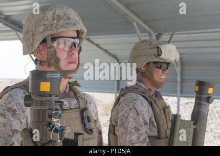 U.S. Marine Corps Lance Cpl. Brandon Dziurgot (left) and Lance Cpl. Cody Enriquez, Low Altitude Air Defense (LAAD) gunners with 3rd LAAD Battalion, Marine Air Control Group 38 (MACG-38), 3rd Marine Aircraft Wing (3D MAW) wait to fire the FIM-92 Stinger during a live fire exercise at Yuma Proving Grounds, Yuma, Ariz., July 8, 2017. 3rd LAAD Battalion conducted the exercise in order to maintain proficiency and accuracy with the FIM-92 Stinger. Stock Photo