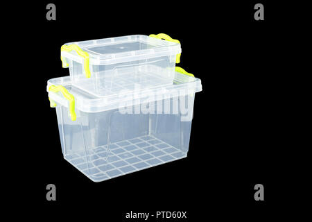 Home and garden Containers - Big and small  two white Plastic storage on a black background Stock Photo