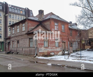 rundown wooden old house seen in Riga at winter time Stock Photo