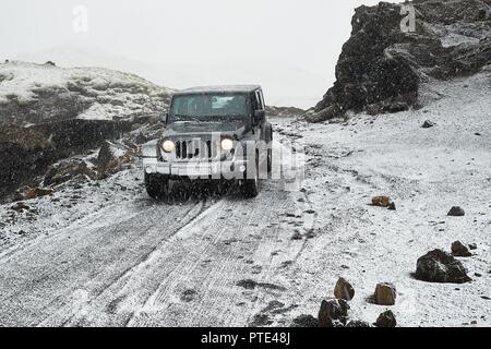 Jeep Wrangler on Icelandic terrain with snow Stock Photo