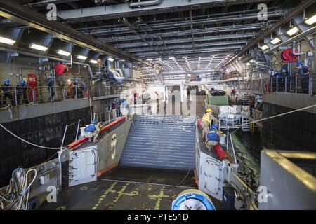 Landing Craft Utility 1666 enters the well deck of amphibious transport ...