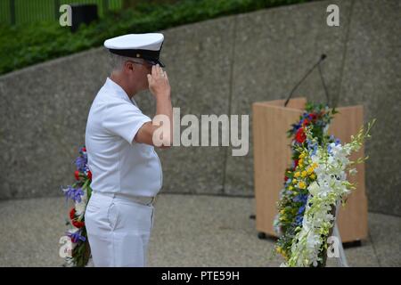 GRAND RAPIDS, Mich. (July 14, 2017) U.S. Navy Chief David L. Johnston, senior enlisted leader of Navy Operational Support Center Battle Creek, honors President Gerald R. Ford today at the gravesite wreath service. This day would be the 104th birthday of Ford. Before his appointment as president, Ford served in the U.S. Navy Reserve. He will be honored in Norfolk, Va., Saturday, July 22nd, 2017 with the commissioning of the USS Gerald R. Ford (CVN-78). Stock Photo