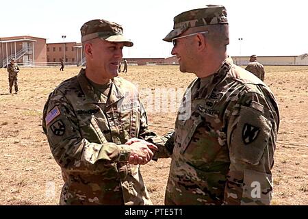 Col. Steven Shepherd, Black Sea Area Support Team commander, speaks with Brig. Gen. Steven Ainsworth, 7th Mission Support Command commanding general and 21st Theater Sustainment Command deputy commanding general, July 11, following the Saber Guardian 17 opening ceremony at Novo Selo Training Area, Bulgaria. Stock Photo