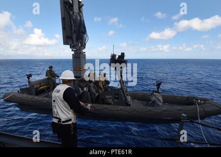 PACIFIC OCEAN (July 14, 2017) - Sailors assigned to Assault Craft Unit 1 are lowered to the water line in a rigid-hull, inflatable boat aboard the amphibious transport dock ship USS San Diego (LPD 22) during a sustainment exercise. San Diego is embarked on a scheduled deployment as part of the America Amphibious Ready Group, which is comprised of more than 1,800 Sailors and 2,600 Marines assigned to the amphibious assault ship USS America (LHA 6), the amphibious dock landing ship USS Pearl Harbor (LSD 52) and San Diego. Stock Photo