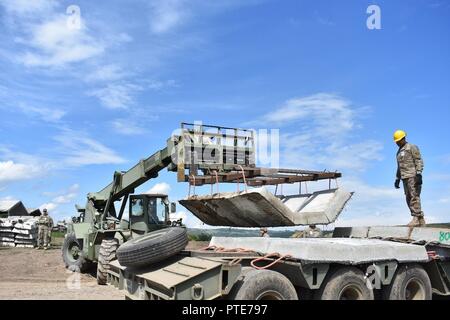 https://l450v.alamy.com/450v/pte797/soldiers-of-the-926th-engineer-brigade-move-concrete-mats-at-operation-resolute-castle-2017-at-joint-national-training-center-cincu-romania-these-mats-will-form-the-base-for-moving-targets-at-the-non-standard-live-fire-range-resolute-castle-is-an-exercise-strengthening-the-nato-alliance-and-enhancing-its-capacity-for-joint-training-and-response-to-threats-within-the-region-pte797.jpg