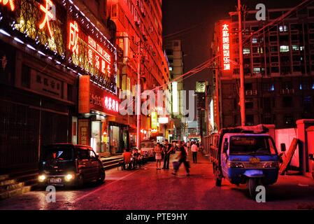 Beijing / China - JUN 24 2011: night street city scene with strong neon lights
