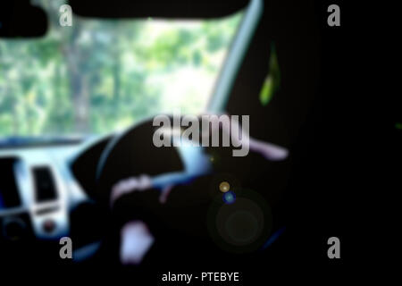 blurred image of people driving car on day time. Stock Photo