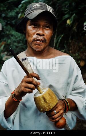 Santa Marta, Magdalena / Colombia - MARCH 10 2016 : tribal kogi man with his poporo the ancient device helping the tairona nation to think and to coll Stock Photo