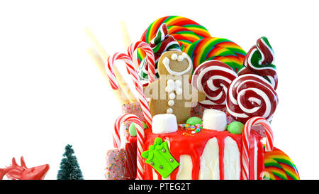 On trend festive candyland Christmas drip cake on white background. Stock Photo