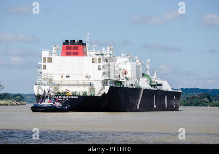 Liquefied natural gas (LNG) vessel transiting through de Panama Canal at the southwestern end of Gatun Lake and the confluence with the Chagres River Stock Photo