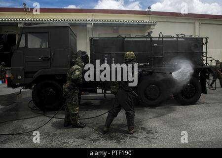 https://l450v.alamy.com/450v/ptf190/us-marine-lance-cpl-enrique-puentes-jr-sprays-water-on-a-japanese-decontamination-truck-with-a-japanese-ground-self-defense-member-during-a-simulated-joint-study-with-the-jgsdf-at-marine-corps-air-station-futenma-on-july-13-2017-the-marines-and-jgsdf-soldiers-were-integrated-into-one-force-combining-us-and-japanese-equipment-while-utilizing-both-countries-methods-of-decontamination-puentes-a-native-of-tampa-florida-is-a-cbrn-defense-specialist-with-marine-wing-headquarters-squadron-1-and-the-jgsdf-soldier-is-with-15th-nuclear-biological-chemical-defense-unit-ptf190.jpg