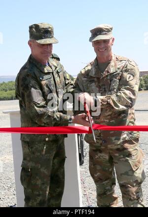 Vice Adm. Emil Eftimov, Bulgarian Deputy Chief of Defense, and U.S. Army Maj. Gen. John Gronski, Deputy Commanding General for the Army National Guard, U.S. Army Europe, at the Novo Selo Training Area recognize the completion of 10 projects worth more than $4 million by the U.S. Army Corps of Engineers and contractors with a ribbon cutting ceremony. Saber  Guardian is a U.S. Army Europe-led, multinational exercise that spans across Bulgaria,  Hungary, and Romania with more than 25,000 service members 22 allied and partner  nations. Stock Photo