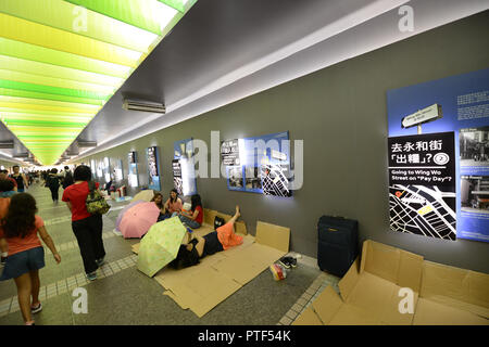 Filipino domestic helpers enjoying their Sunday ( day off ) in Hong Kong Central district. Stock Photo