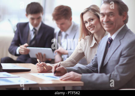 businessman and assistant in the workplace in the office Stock Photo