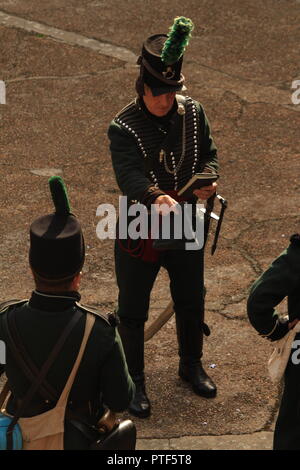 Filming overhead  side-shot POV- Rifleman Diaries- Group of three Riflemen at a re-enactment. Stock Photo