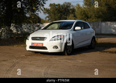 DNIPRO, UKRAINE - SEPTEMBER 05, 2017: KIA CEED WHITE COLOR NEAR THE ROAD IN THE DNIPRO CITY Stock Photo