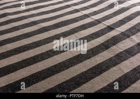 clothing items washed cotton fabric striped texture with seams, macro, close-up Stock Photo