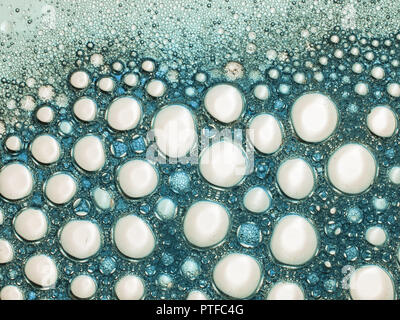 Beautiful bubbles, froth. Turquoise and white soapy lather. Stock Photo