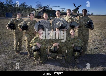 Women pilots from the Australian and the United States Army are at the Shoalwater Bay Training Area as part of Battle Group Pegasus during Exercise Talisman Saber 2017. From left standing: United States Army Major Alicia McCraw, Lieutenant Colonel Liz Martin, Chief Warrant Officer Two Amy Fox, Captain Christina Smith, 1st Lieutenant Kacie Ryan and 1st Lieutenant Tiffany Spears.   From left knealing: Australian Army Lieutenant Bonnie Hunt, Captain Candice Priebbenow and Captain Tarryn Ryan. (Royal Australian Air Force Stock Photo