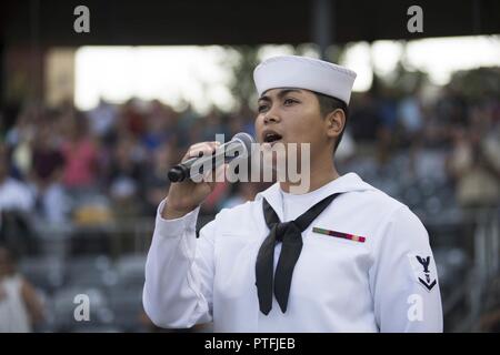 ST. PAUL, Minn. (July 21, 2017) – Navy Musician 3rd Class Danlie Clunca, a native of Norfolk, Va. And assigned to Navy Band Great Lakes, sings the Star Spangled Banner at CHS Field, home of the St. Paul Saints, during Minneapolis/St. Paul Navy Week. Navy Week programs serve as the Navy's principal outreach effort into areas of the country without a significant Navy presence, with 195 Navy Weeks held in 71 different U.S. cities. Stock Photo