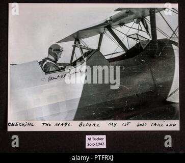 A photograph of Al Tucker Jr., preparing to takeoff for his first solo flight in a PT-17 Stearman at the United States Military Academy at West Point, N.Y. in 1942, adorns to wall of the hanger of First Sgt. David Brown, Air Force Reserve, at Warrenton-Fauquier Airport in Warrenton, Va., Jul. 20, 2017. Brown, who has been flying since he was a teenager and began working at the Flying Circus Aerodrome in Bealeton, Va., has been allowing Tucker, now 96, to fly his biplane for nearly 10 years. Stock Photo