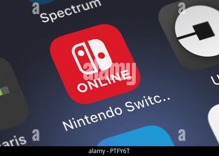 London, United Kingdom - October 09, 2018: Icon of the mobile app Nintendo Switch Online from Nintendo Co., Ltd. on an iPhone. Stock Photo
