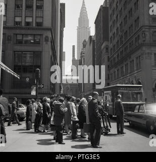 1960s, New Yorkers crossing a street in midtown Manhattan, New York city, New York, USA. Stock Photo