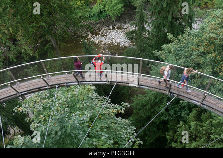 VANCOUVER, CANADA - SEPTEMBER 11th 2018: Visitors on the cliffwalk bridge at Capilano suspension bridge park in North Vancouver Stock Photo