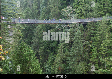 VANCOUVER, CANADA - SEPTEMBER 11th 2018: Visitors cross the 450 ft Capilano suspension bridge in North Vancouver Stock Photo