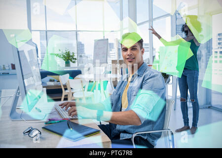 Portrait of male executive with colleague using virtual reality headset Stock Photo